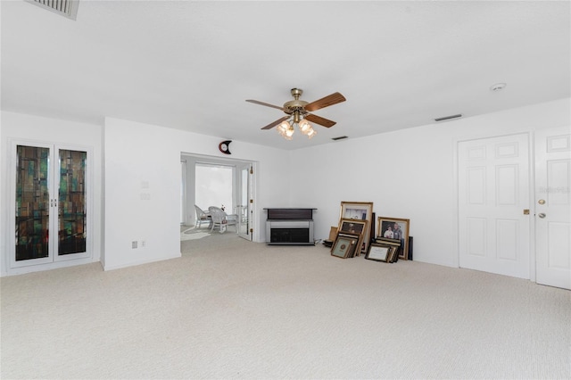 living room with carpet flooring and ceiling fan