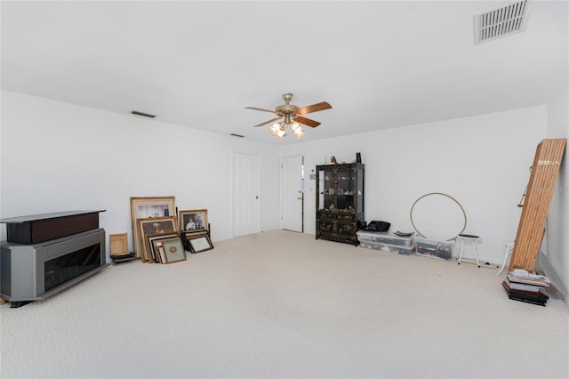 misc room featuring carpet floors and ceiling fan