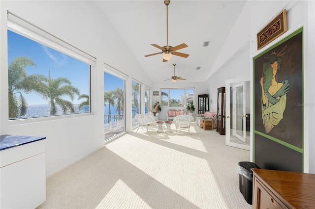 sunroom / solarium with ceiling fan and lofted ceiling