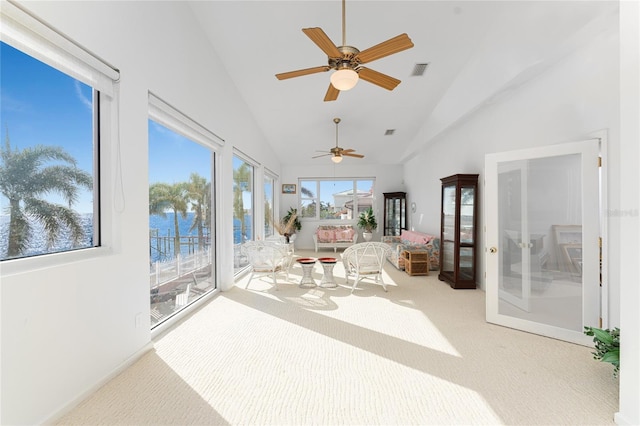 sunroom / solarium featuring vaulted ceiling and french doors