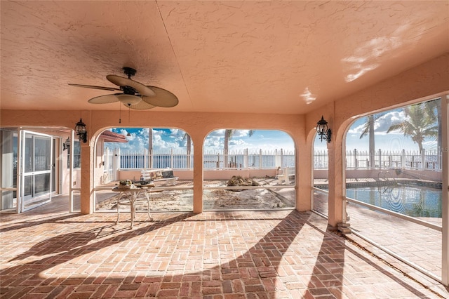 view of patio / terrace featuring ceiling fan