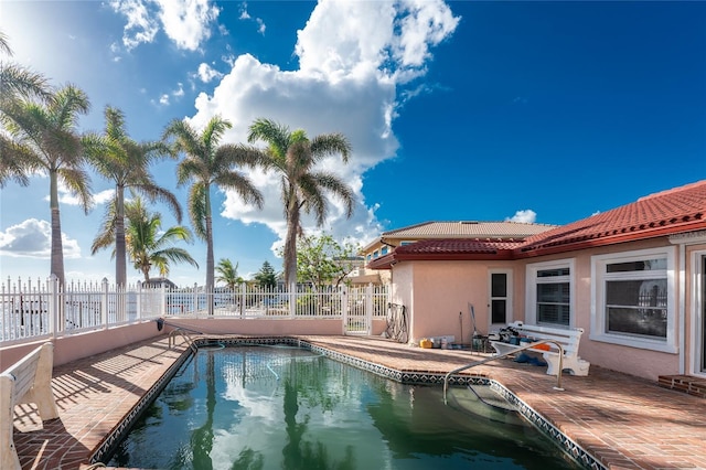 view of swimming pool with a patio area