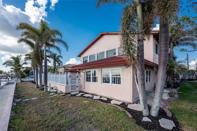 rear view of property with a yard