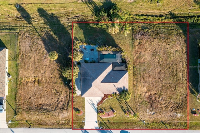 birds eye view of property with a rural view