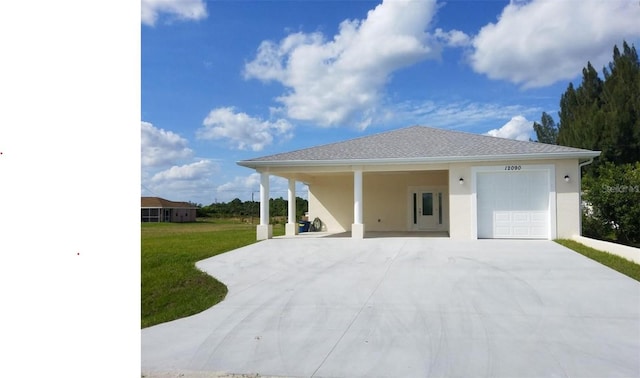 exterior space with a lawn and a carport