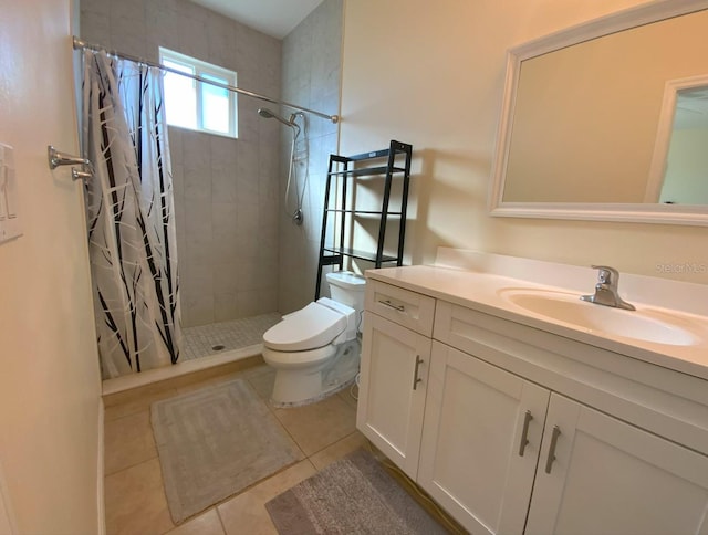 bathroom featuring tile patterned flooring, vanity, curtained shower, and toilet