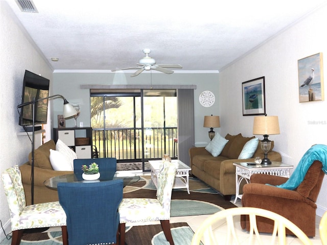 living room featuring crown molding, ceiling fan, and wood-type flooring