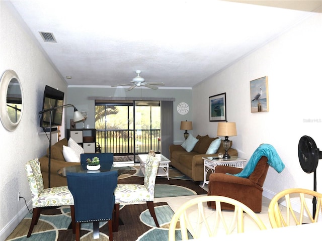 dining space featuring hardwood / wood-style floors, ceiling fan, and ornamental molding