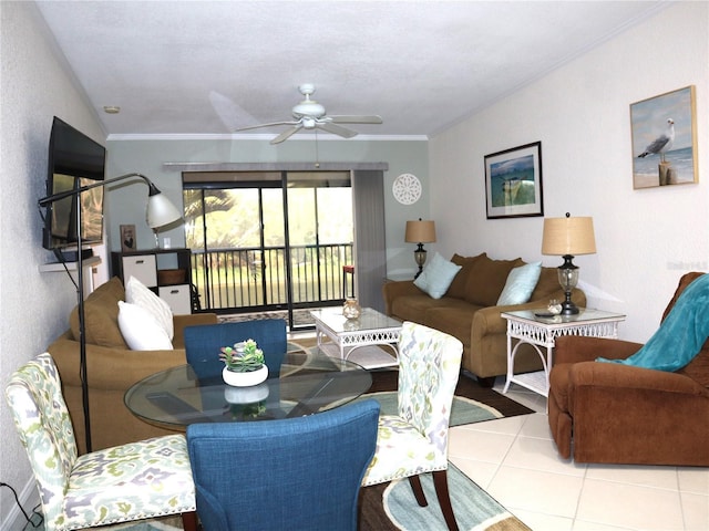 dining room featuring ceiling fan, light tile patterned flooring, and ornamental molding