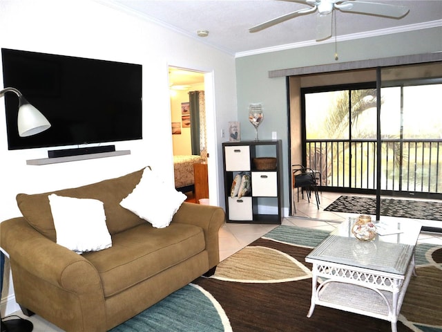 living room with light tile patterned floors, ceiling fan, and ornamental molding