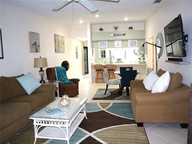 living room featuring ceiling fan and light tile patterned floors