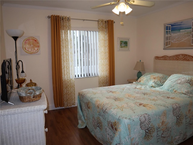 bedroom featuring ceiling fan, dark hardwood / wood-style flooring, and crown molding