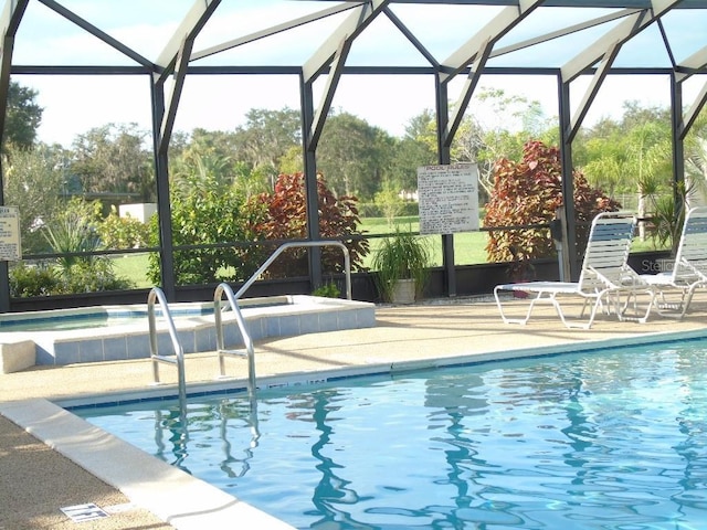 view of swimming pool with a lanai