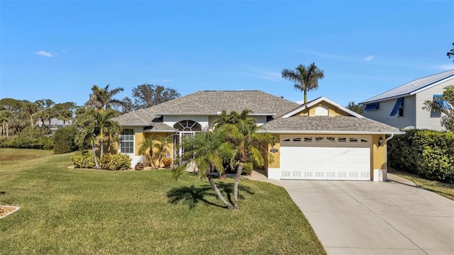 view of front facade featuring a front yard and a garage