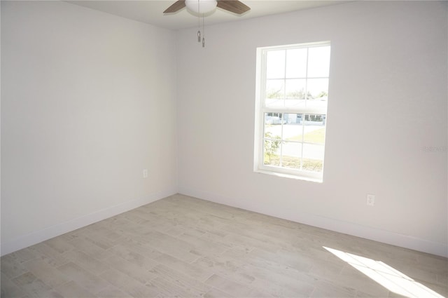 empty room with light hardwood / wood-style flooring and ceiling fan