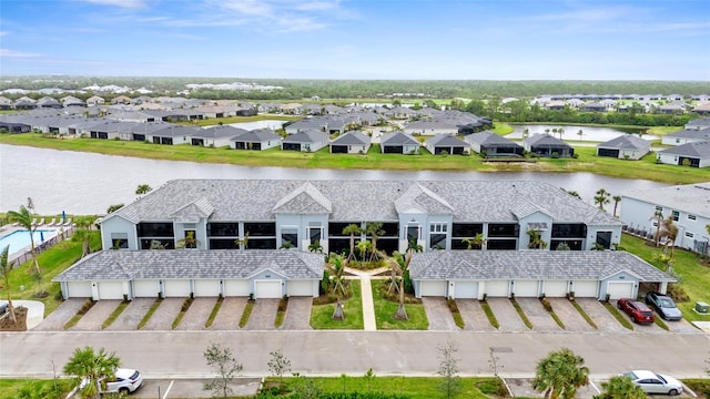 birds eye view of property with a water view