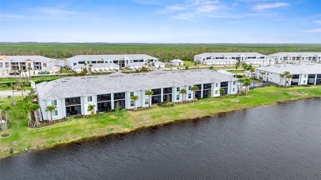 birds eye view of property featuring a water view