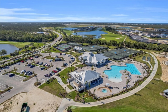 birds eye view of property with a water view