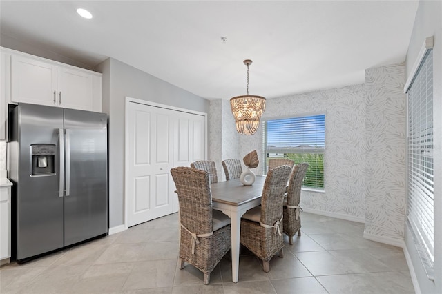 dining space with an inviting chandelier