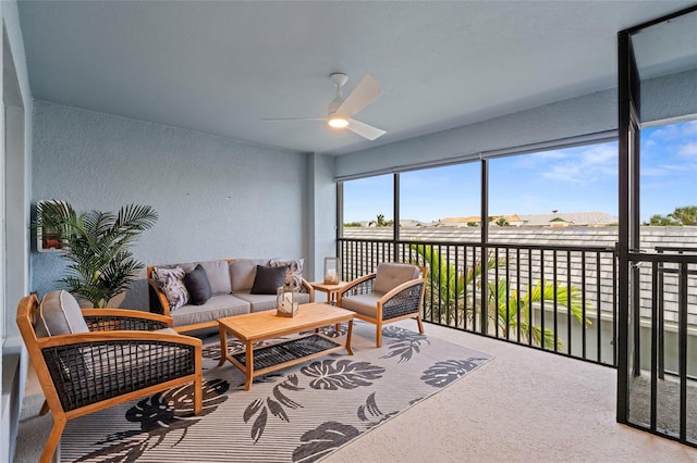 sunroom featuring ceiling fan