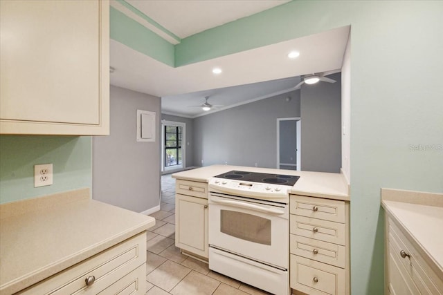 kitchen with ceiling fan, crown molding, cream cabinets, light tile patterned floors, and white electric stove