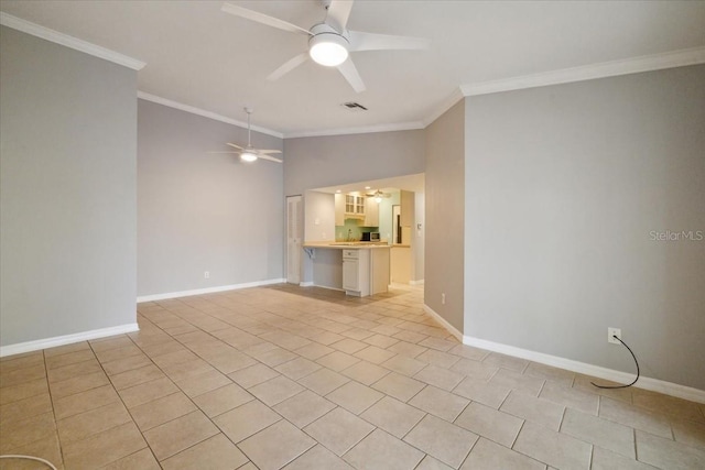 tiled spare room with lofted ceiling, ceiling fan, and crown molding