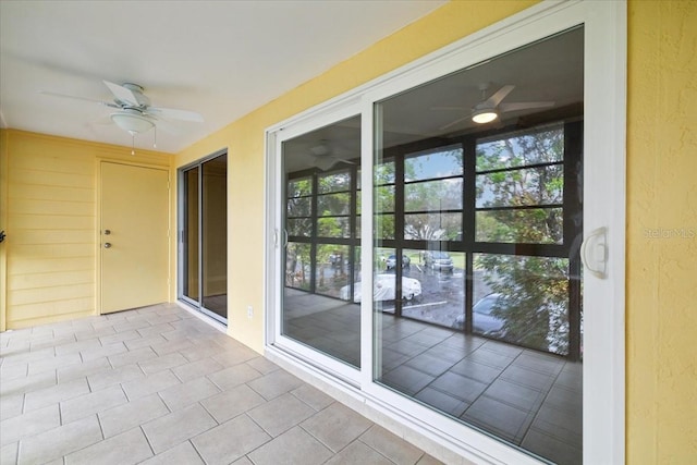 interior space with ceiling fan