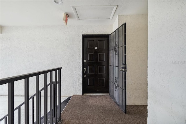 entrance to property with a balcony