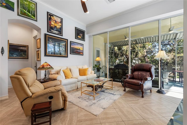 tiled living room featuring crown molding, plenty of natural light, and ceiling fan