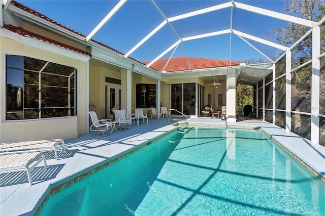 view of pool featuring a lanai, ceiling fan, and a patio