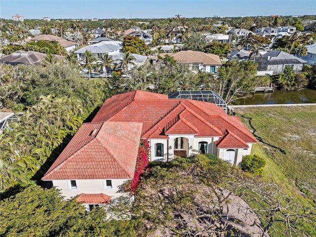 birds eye view of property with a water view