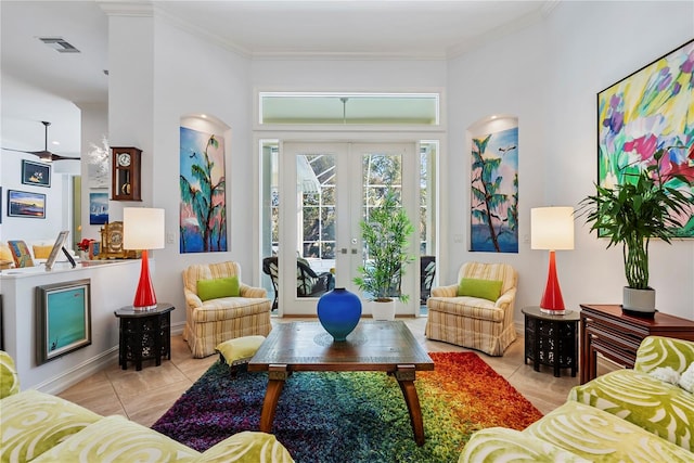 living room featuring french doors, light tile patterned floors, and ornamental molding