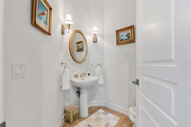 bathroom with tile patterned floors and toilet