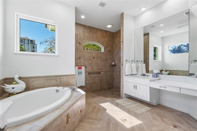 bathroom featuring tile patterned floors, vanity, and independent shower and bath