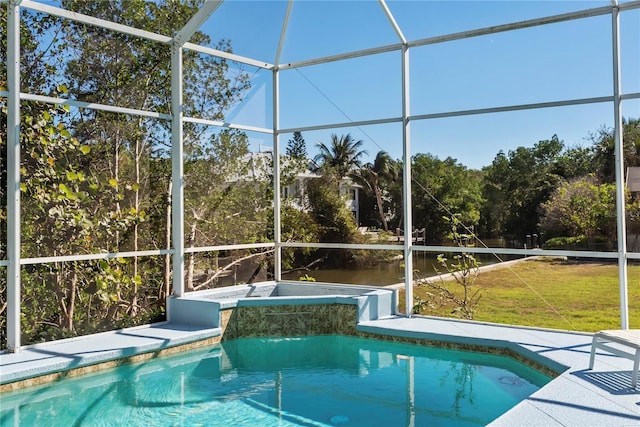 view of swimming pool with a lanai and a yard