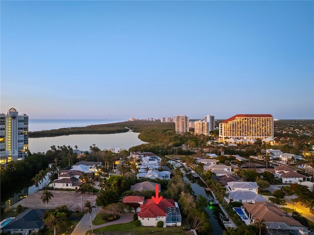 aerial view at dusk with a water view