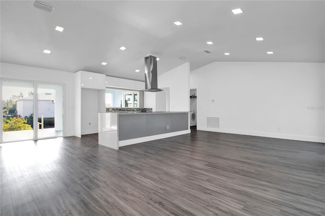 unfurnished living room featuring dark hardwood / wood-style flooring and vaulted ceiling