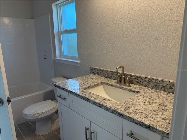 bathroom with a textured wall, tile patterned flooring, toilet, vanity, and  shower combination