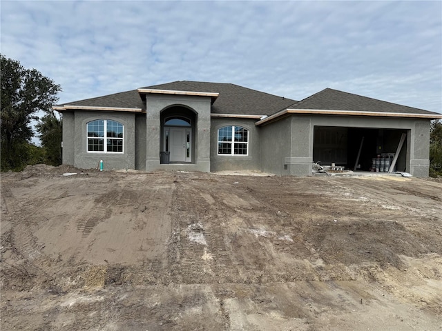 view of front of property with a garage