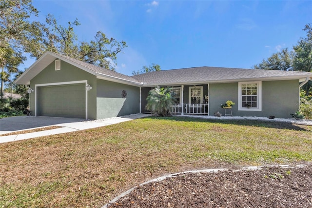 ranch-style house featuring a front yard, a garage, and covered porch