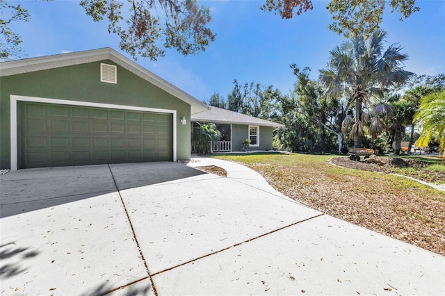 ranch-style home featuring a garage