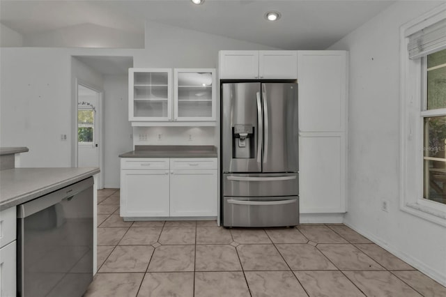 1811 Music Ln, North Port, FL 34286 - kitchen featuring appliances with stainless steel finishes, vaulted ceiling, white cabinetry, glass insert cabinets, and recessed lighting