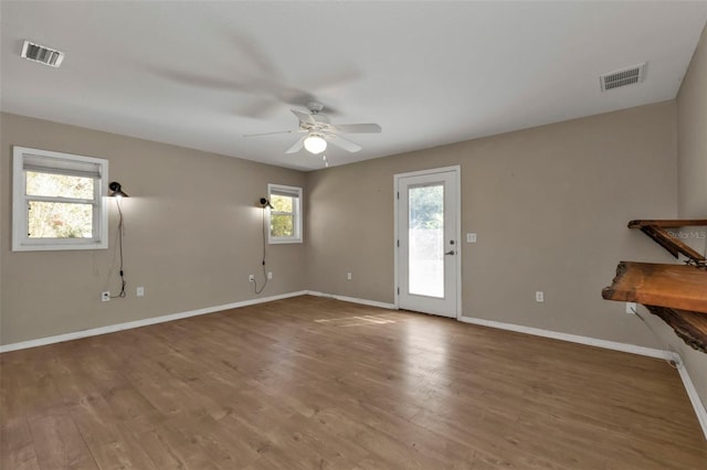 1811 Music Ln, North Port, FL 34286 - empty room with ceiling fan, baseboards, and wood finished floors