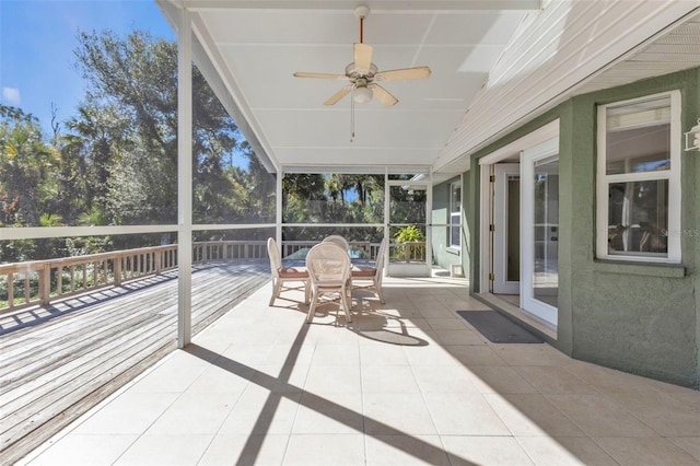 sunroom / solarium with ceiling fan