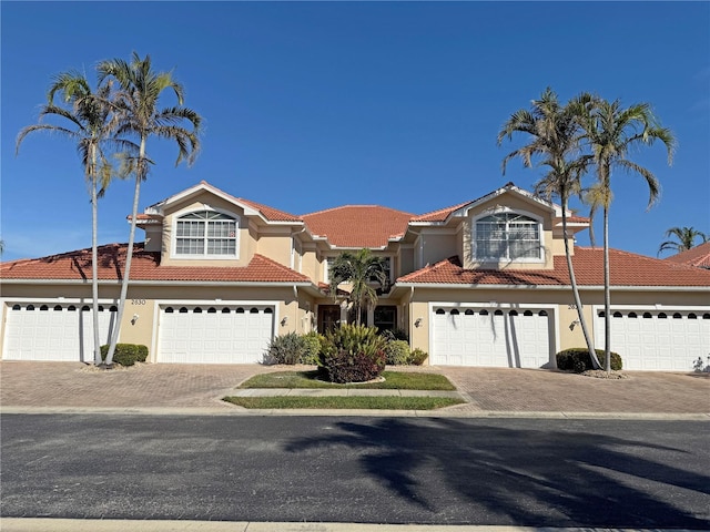 mediterranean / spanish house featuring a garage