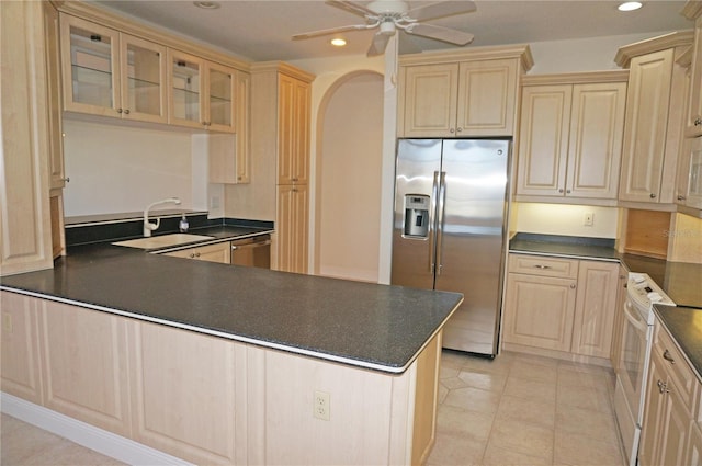 kitchen featuring ceiling fan, sink, stainless steel appliances, light brown cabinetry, and light tile patterned floors