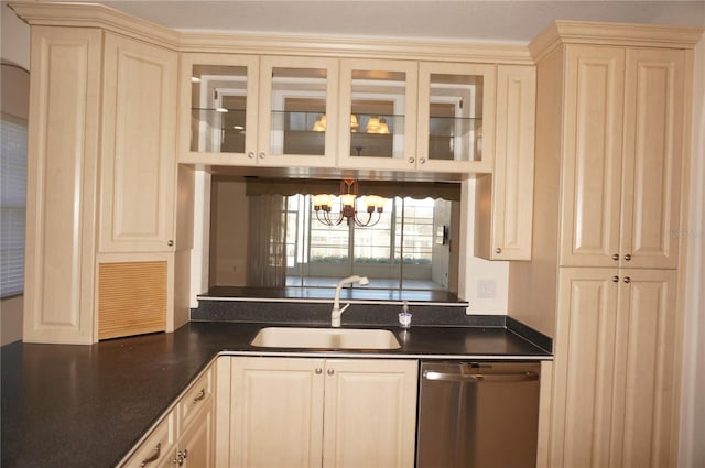 kitchen featuring dishwasher, cream cabinetry, a chandelier, and sink