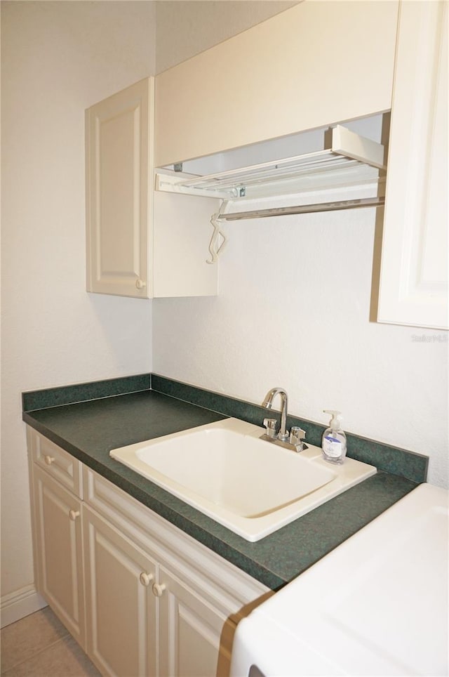 kitchen with tile patterned flooring and sink