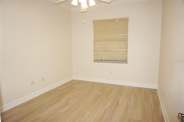 empty room with hardwood / wood-style floors, ceiling fan, and crown molding