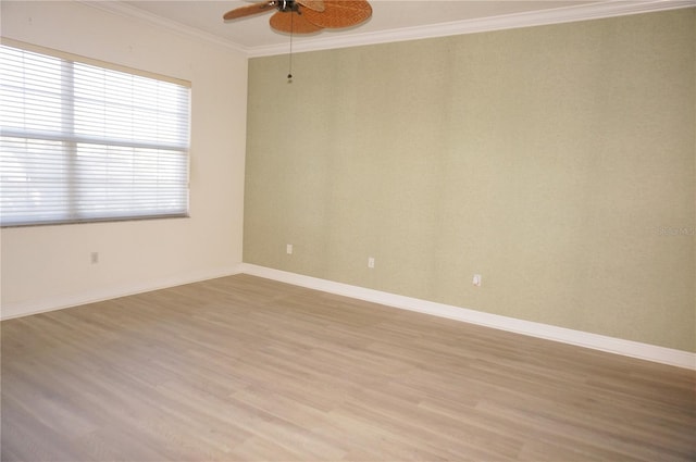 unfurnished room featuring light hardwood / wood-style floors, ceiling fan, and ornamental molding